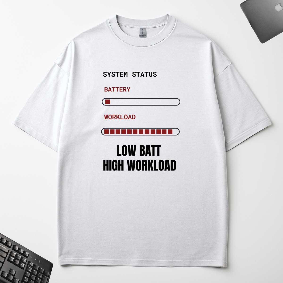 Low Battery High Workload white-oversized t-shirt flat lay on an office desk
