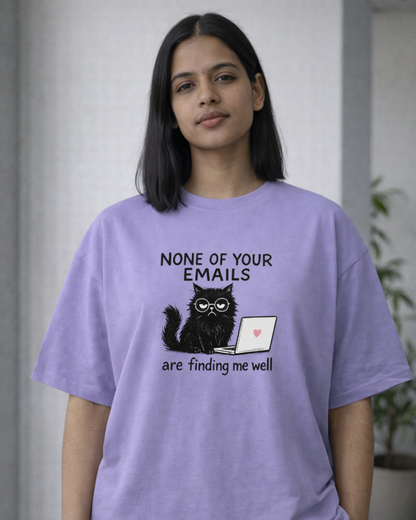 Woman wearing a None of Your Emails Are Finding Me Well oversized t-shirt in a modern office