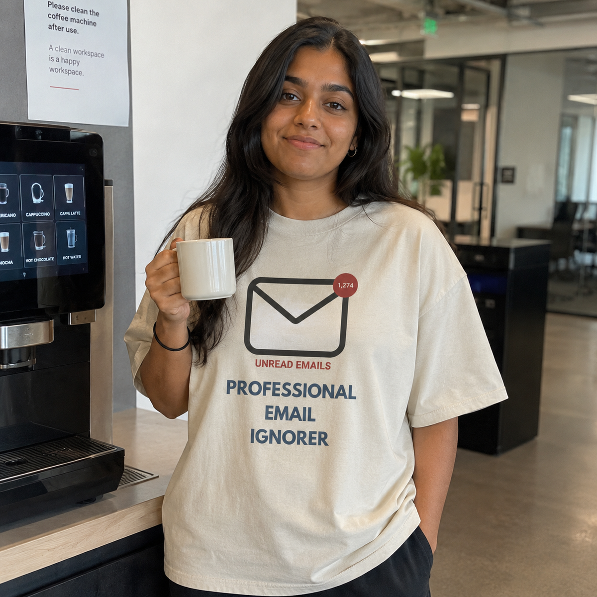 Woman wearing a Professional Email Ignorer oversized t-shirt in a modern office