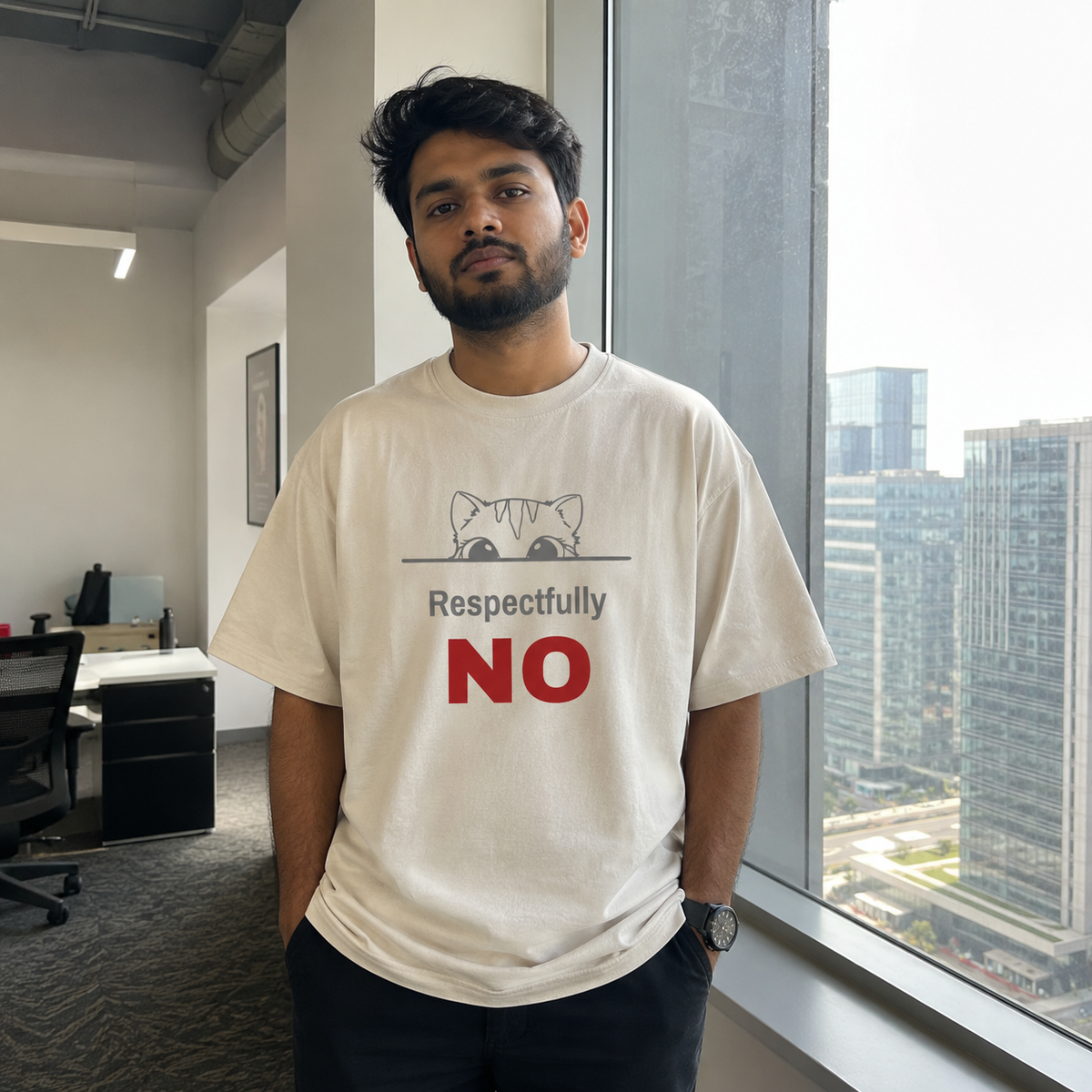 Man wearing a Respectfully No oversized t-shirt in a modern office